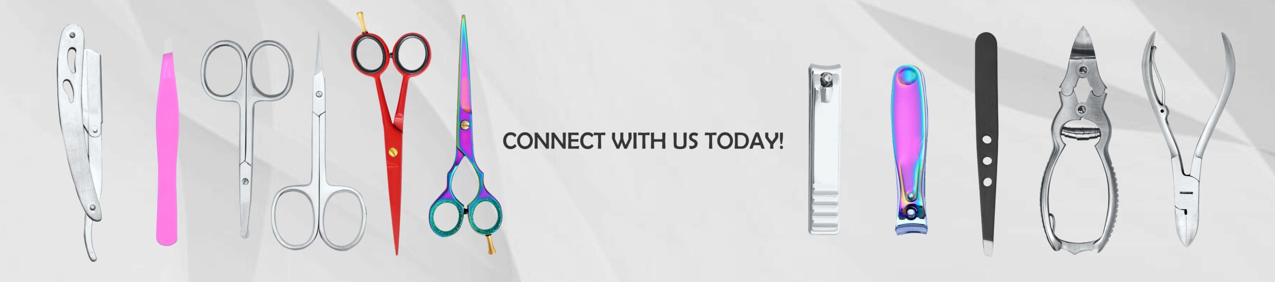 A comprehensive collection of professional grooming tools including stainless steel nail nippers, hairdressing scissors, and curved cuticle shears arranged on a clean surface.